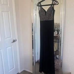 Silver jewel top with long black dress with slit